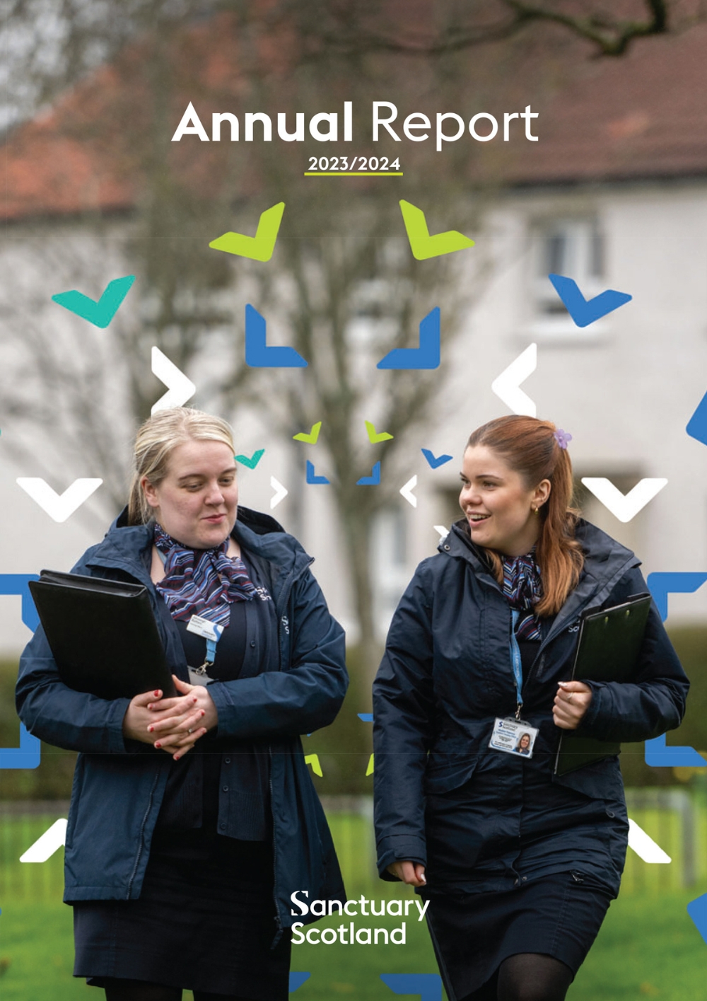 The front cover of the Scotland Annual Report showing two female housing officers walking and having a chat