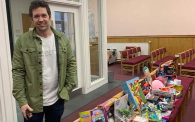 Operations Manager, Alex Ashton with a collection of toys for the Salvation Army appeal in the Toryglen office
