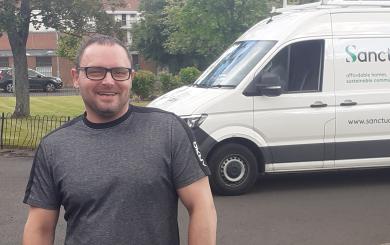 Robert standing outside, in front of a Sanctuary van