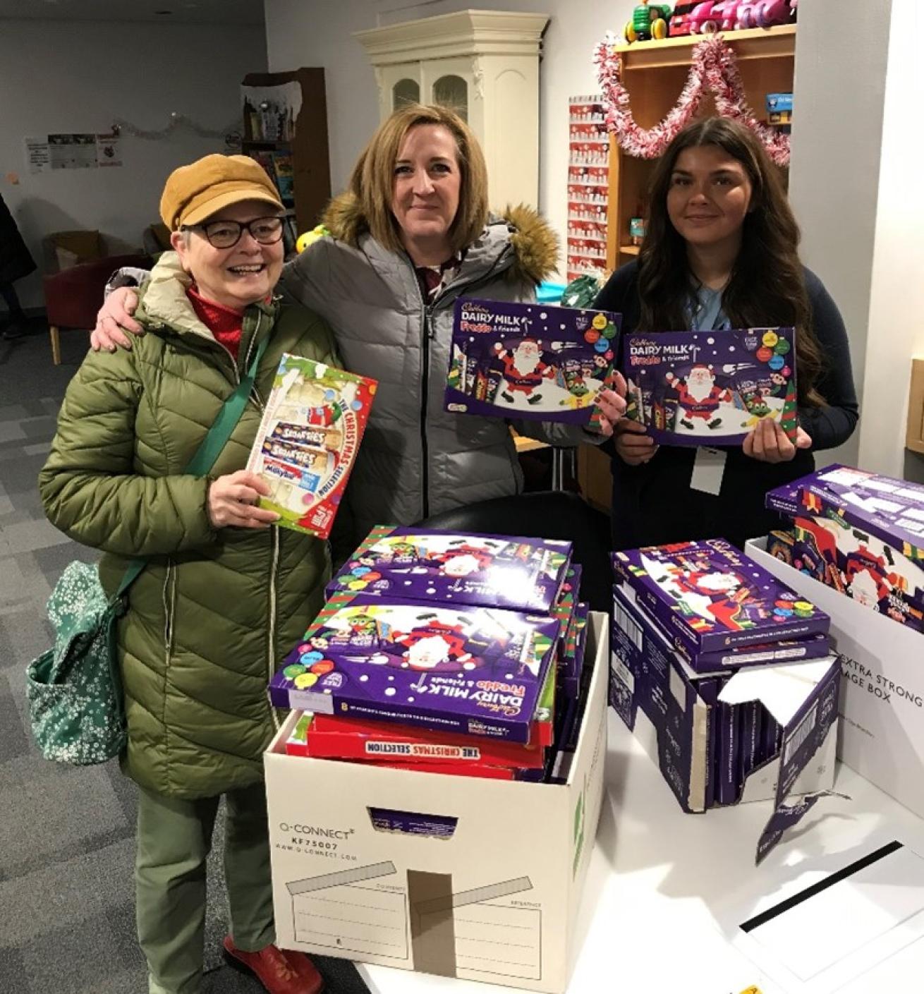 Sanctuary staff with selection boxes that they delivered