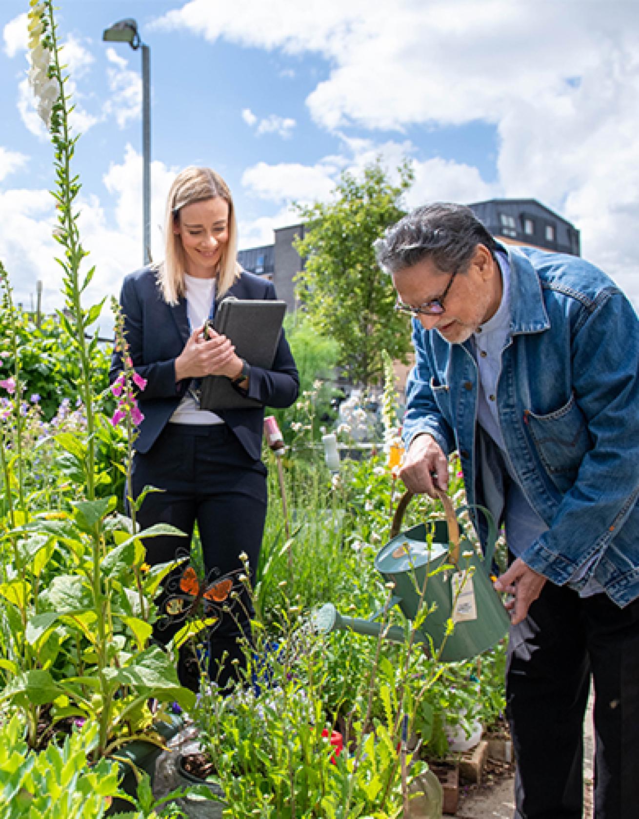 Housing Officer Janine Pulling with resident Rana Jude at Anderston allotments