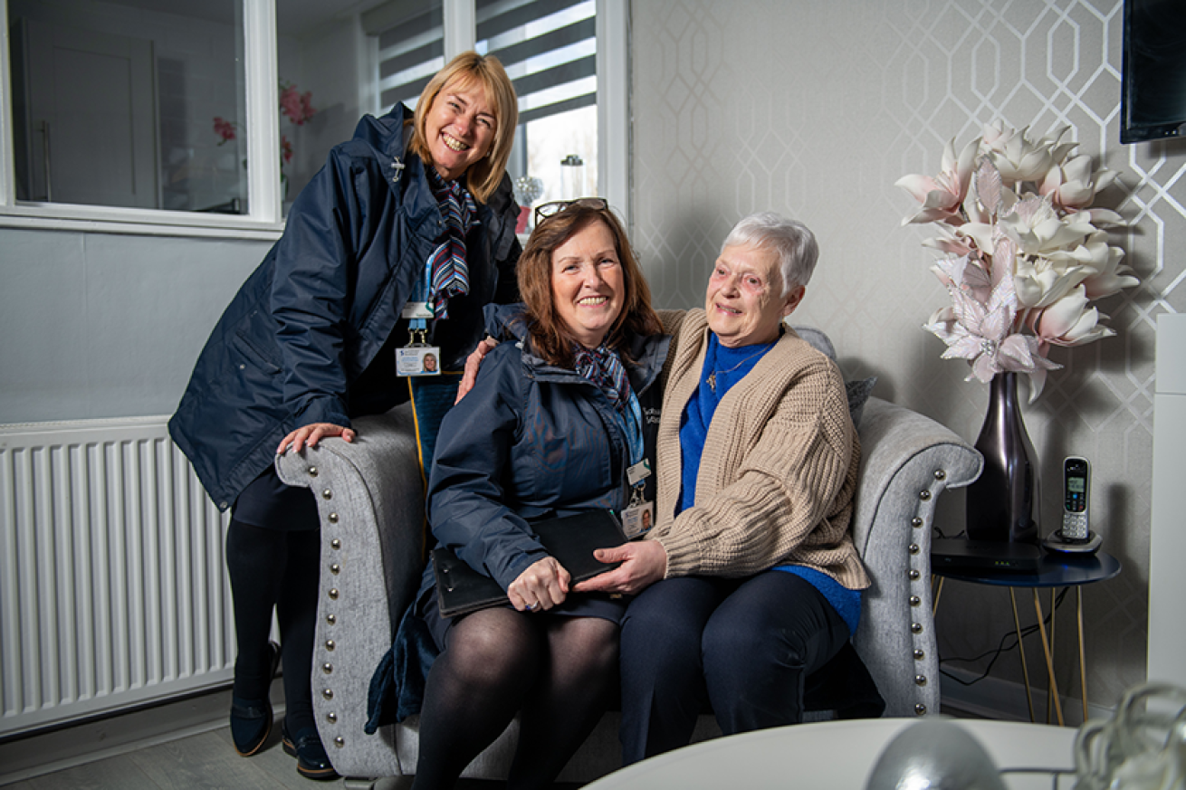 Sanctuary member of staff with residents in Toryglen, Glasgow.