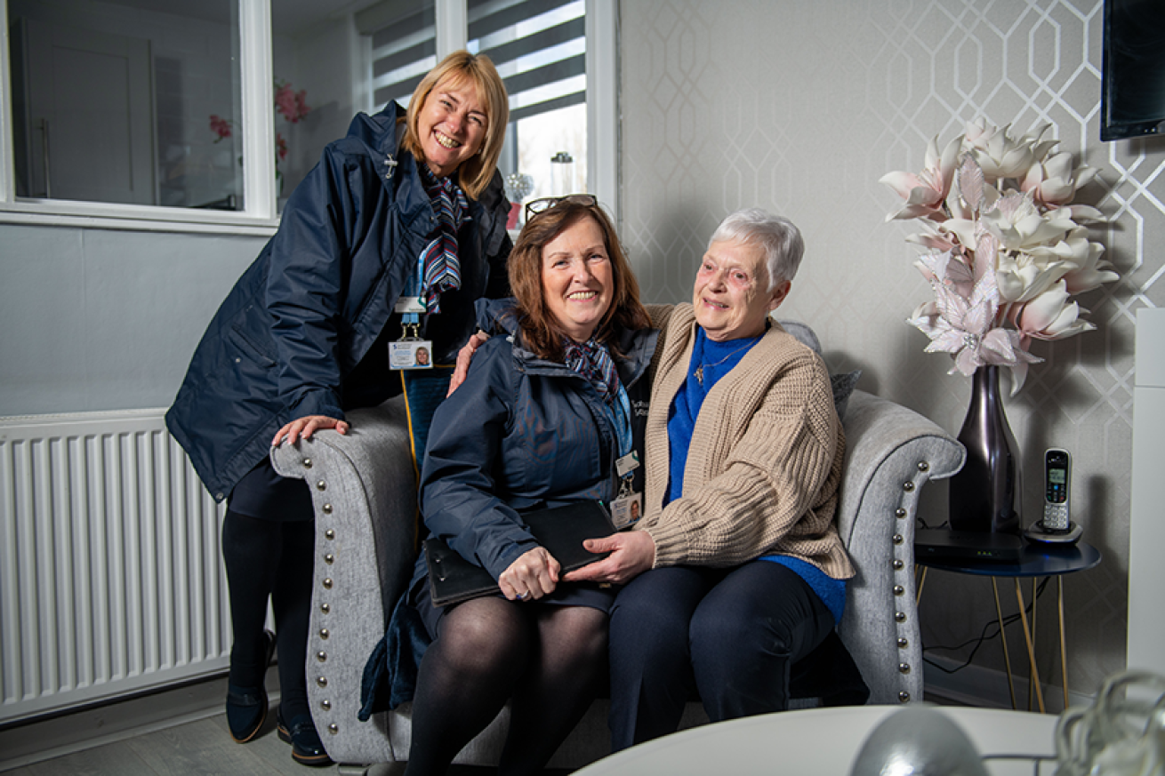 Sanctuary member of staff with residents in Toryglen, Glasgow. 