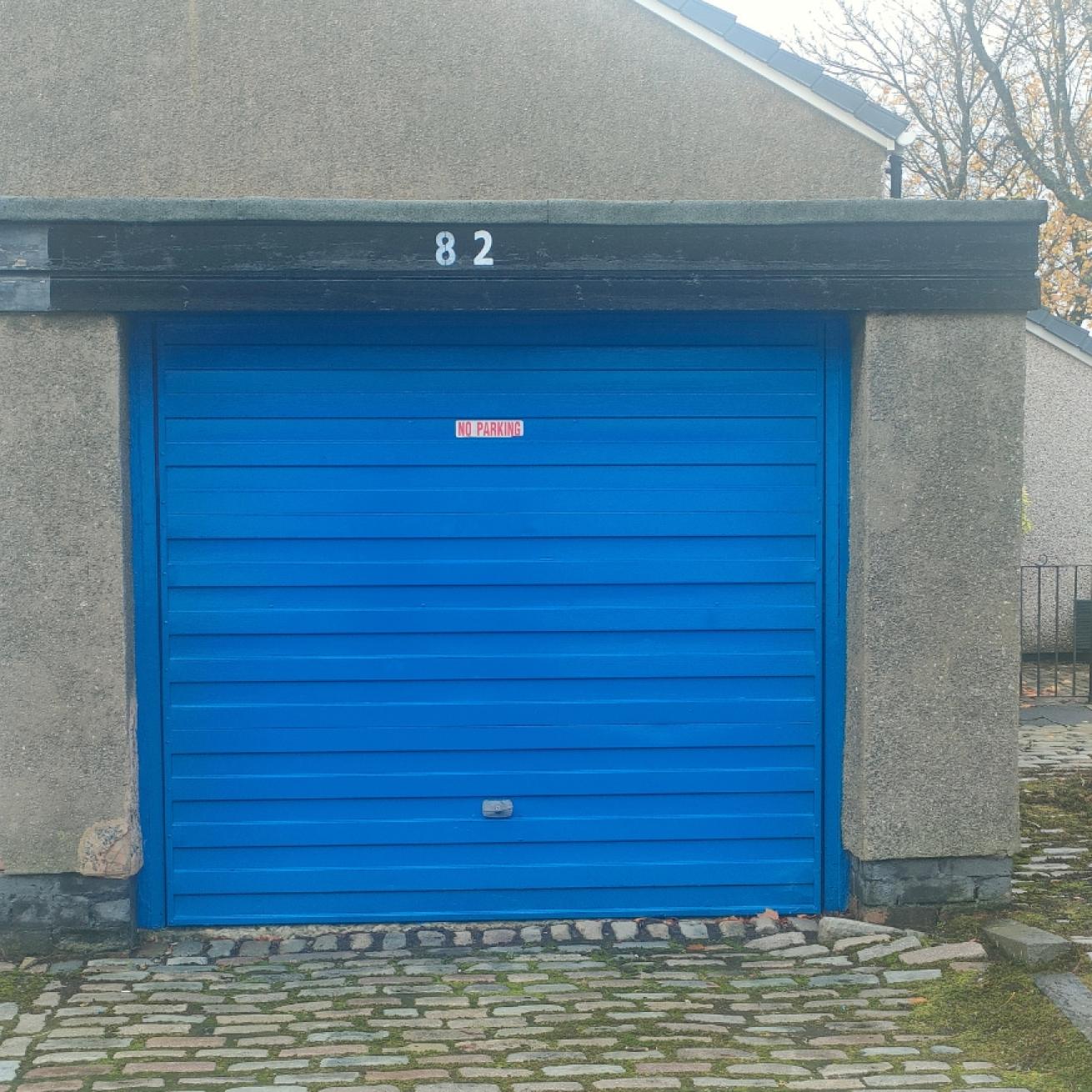 A garage with a blue door