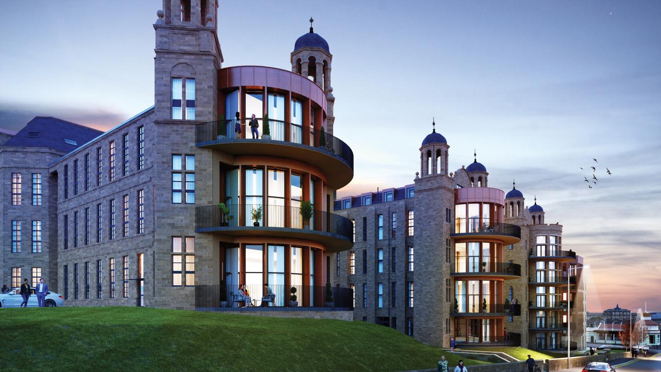 Architectural building with domed towers, rounded glass balconies, large windows, grassy hill, and people visible at dusk in a scenic setting.