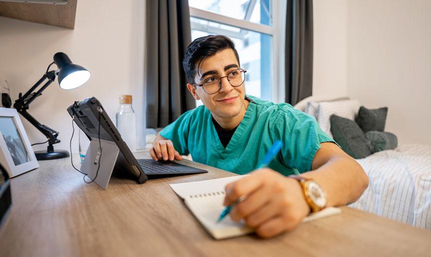 A keyworker studying within their accommodation.