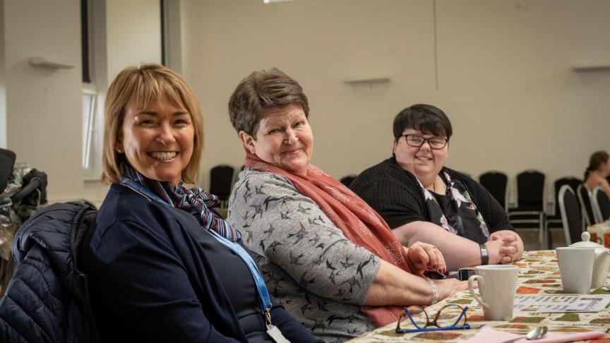 Lorraine Quinn, Isabel Kerr and Natasha Cox sat at a table smiling