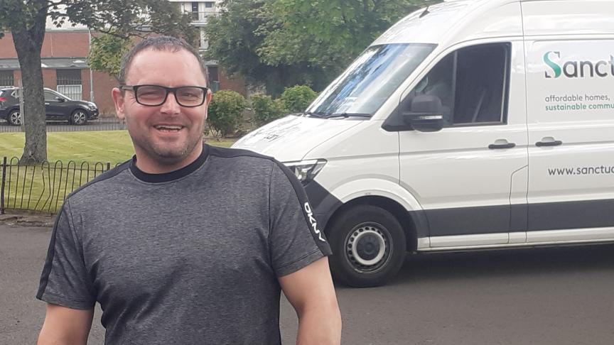 Robert standing outside, in front of a Sanctuary van